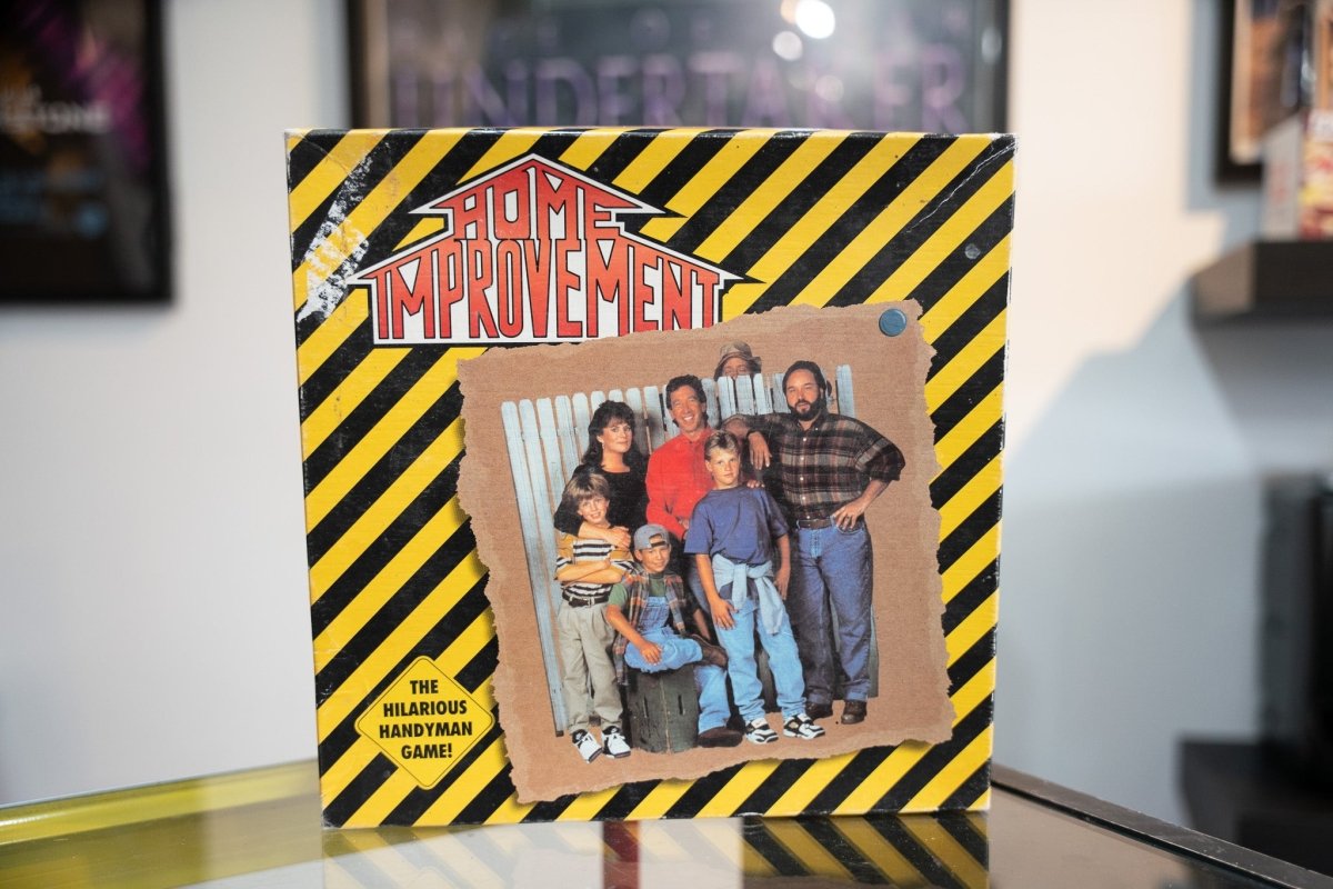 1993 Home Improvement board game square box yellow black hazard stripes cast photo Tim Allen family Home Improvement logo Hilarious Handyman Game