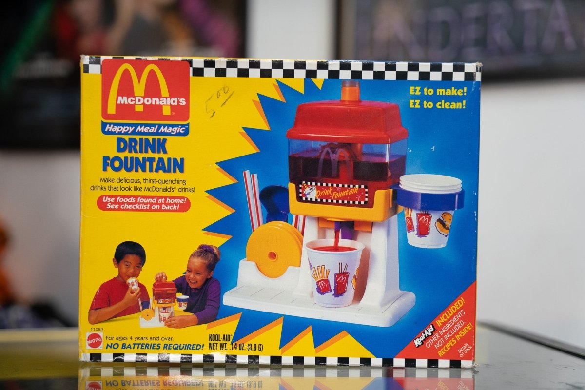 1993 McDonald's Happy Meal Magic Drink Fountain sealed in original yellow Mattel box with red yellow fountain toy golden arches logo and Kool-Aid included