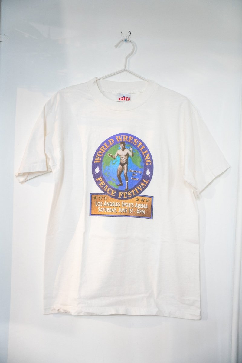 White 1996 World Wrestling Peace Festival t-shirt with circular logo featuring wrestler on globe peace doves and Los Angeles Sports Arena June 1st event banner size Large