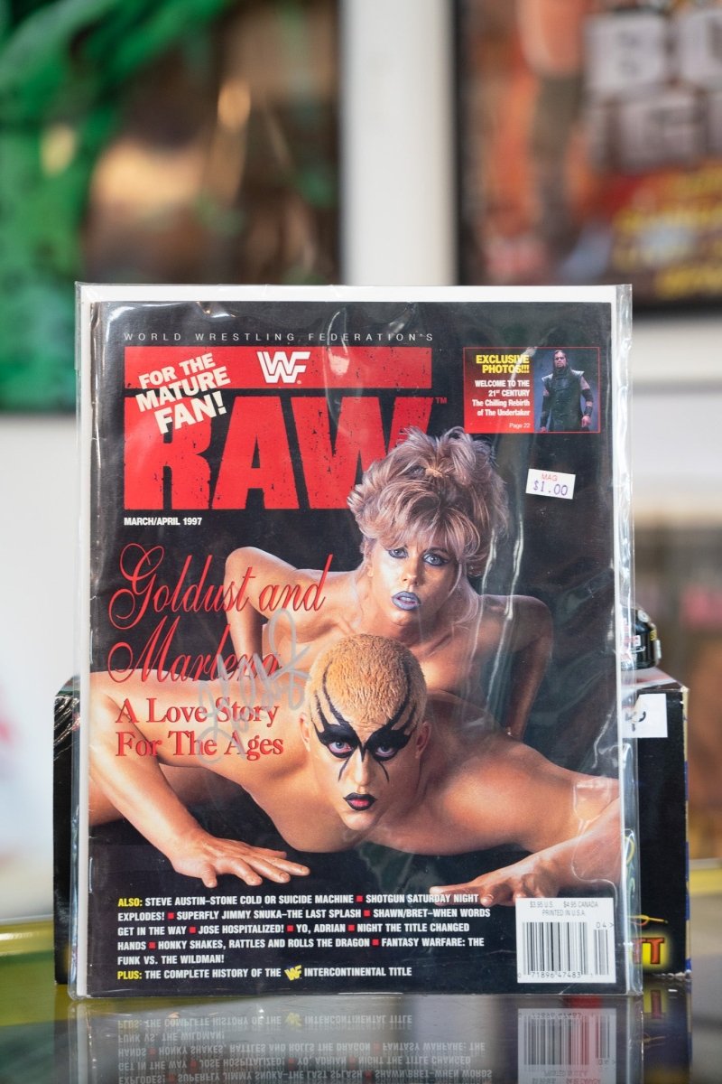 WWF RAW Magazine April 1997 issue featuring Goldust and Marlena on cover, autographed wrestling memorabilia