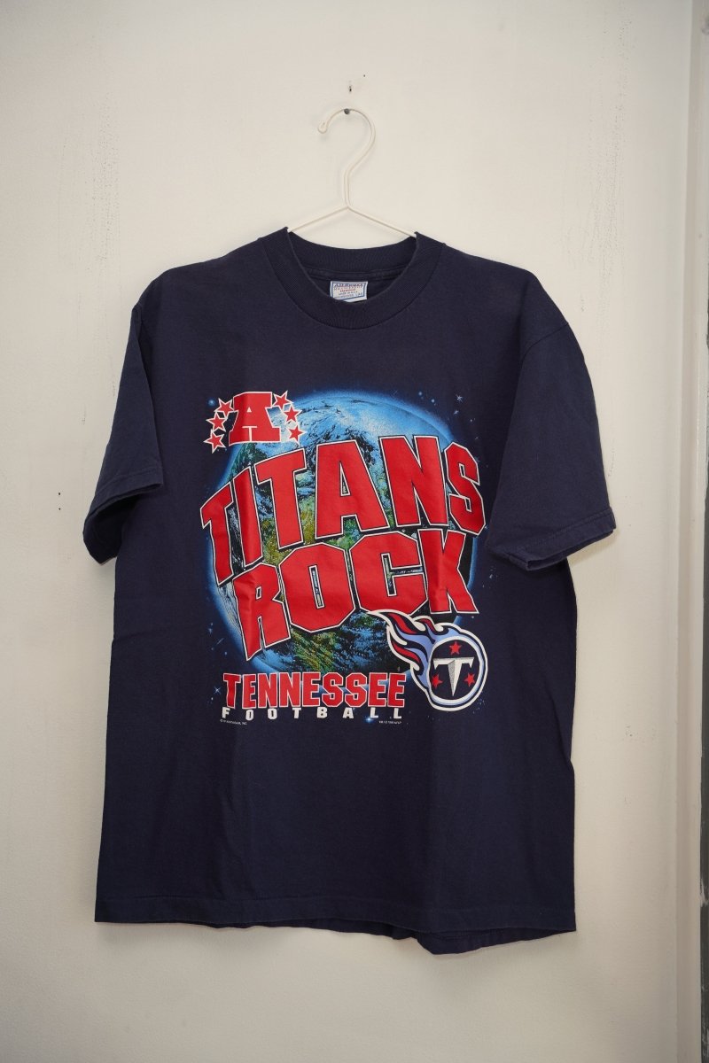 Navy 1999 Tennessee Titans Rock tee TITANS ROCK red text globe AFC logo Titans flaming T logo TENNESSEE FOOTBALL