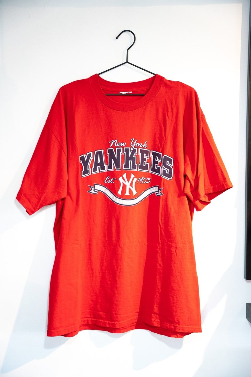 Red 2004 MLB New York Yankees logo tee with white New York script navy YANKEES block lettering interlocking NY Est 1903 banner size XL