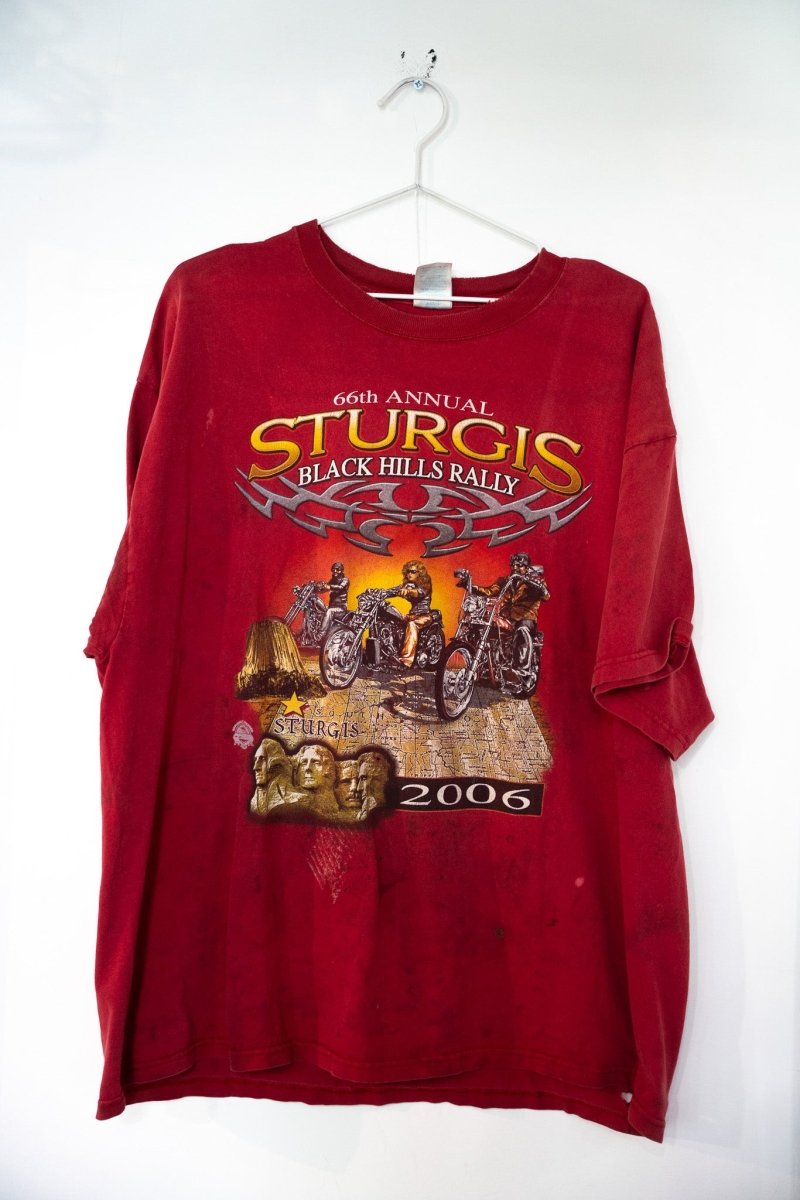 Dark red 2006 66th Annual Sturgis Black Hills Rally t-shirt with silver STURGIS lettering three bikers choppers sunset Mount Rushmore Devils Tower and heavy wear size XXL