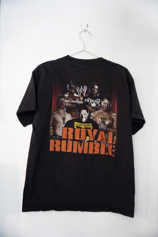 WWE 2011 Royal Rumble event t-shirt in size large, featuring John Cena and Randy Orton graphics printed on dark fabric