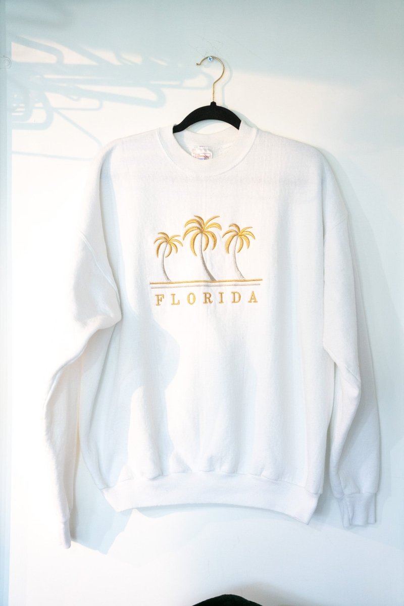 White 90s Florida crewneck sweatshirt with embroidered gold palm trees and spaced FLORIDA lettering ribbed collar cuffs size XL