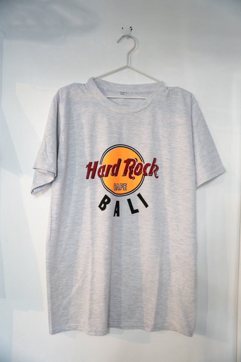 Hard Rock Cafe Bali graphic t-shirt in size XL from the 1990s, featuring printed logo and design on navy blue cotton fabric