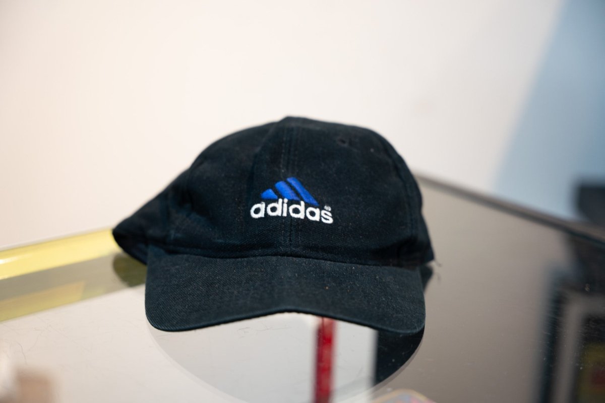 Black Adidas logo cap blue three-stripe Equipment triangle logo white adidas text embroidered unstructured low-profile curved brim