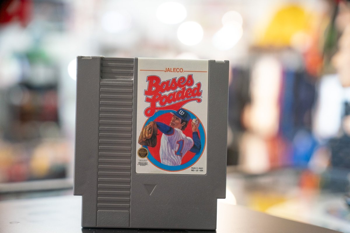 Bases Loaded Nintendo NES cartridge from 1988, Jaleco label visible on black plastic game case with red and white game artwork