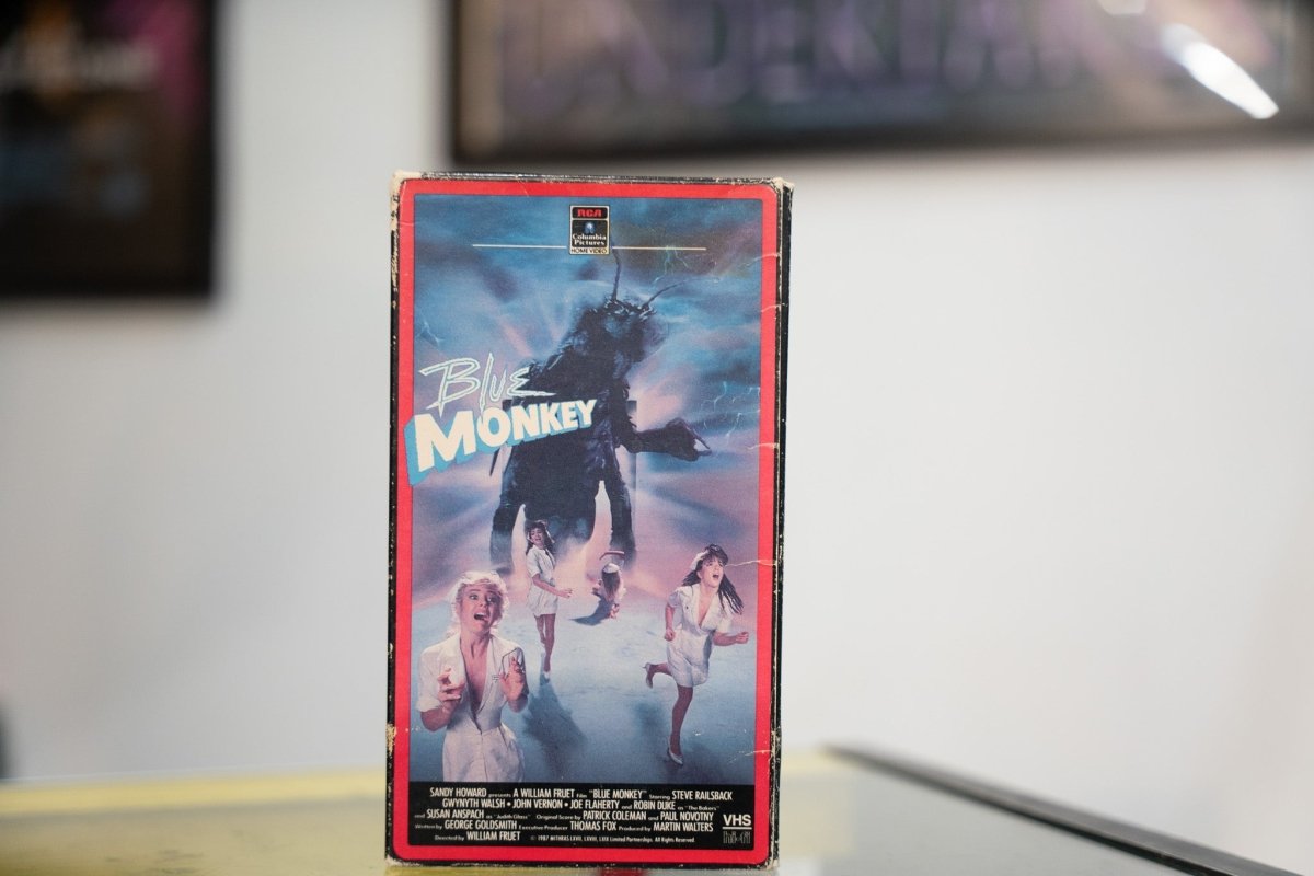 Blue Monkey VHS red-bordered sleeve with giant insect creature above two women running blue white energy backdrop and RCA Columbia Pictures Home Video