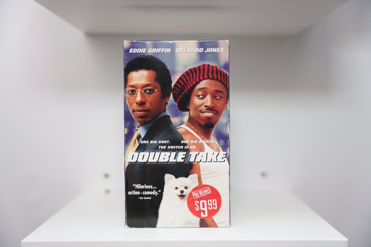 VHS Double Take Eddie Griffin suit glasses Orlando Jones tank top beanie white dog DOUBLE TAKE metallic text Sun Sentinel Pre-Viewed