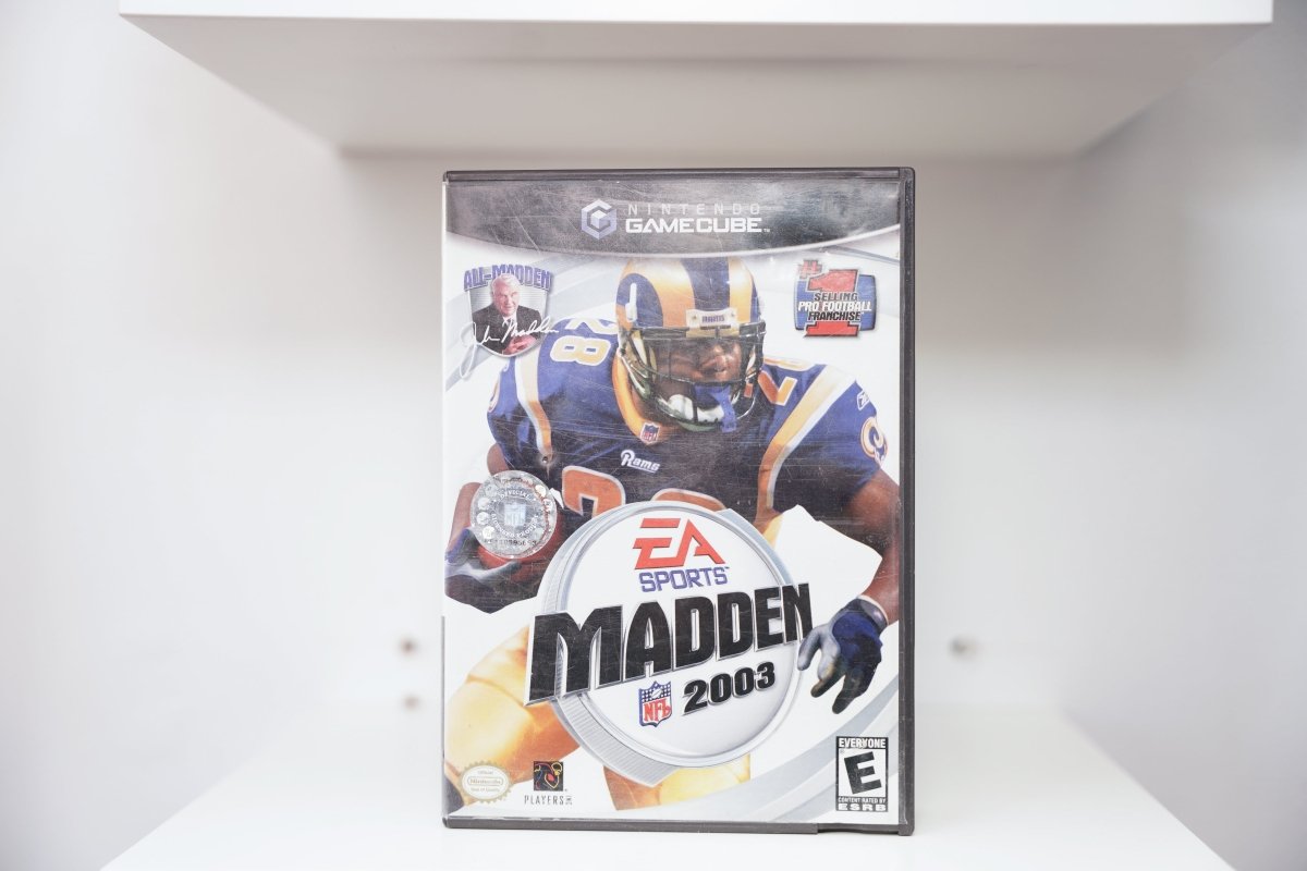 GameCube Madden NFL 2003 case with Marshall Faulk in Rams blue jersey running, EA Sports logo, All-Madden badge, #1 Selling Football badge