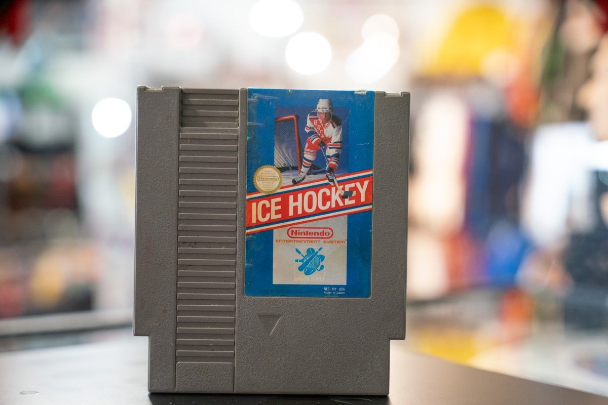 Nintendo Ice Hockey original 1988 NES cartridge with black label and red text showing game title and Nintendo branding on white background