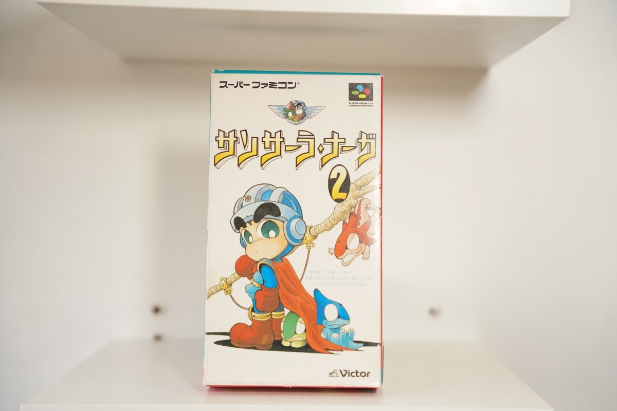 Super Famicom Sansara Naga 2 CIB box chibi hero helmet goggles red cape staff dragon Sansara Naga 2 gold text Victor Nintendo