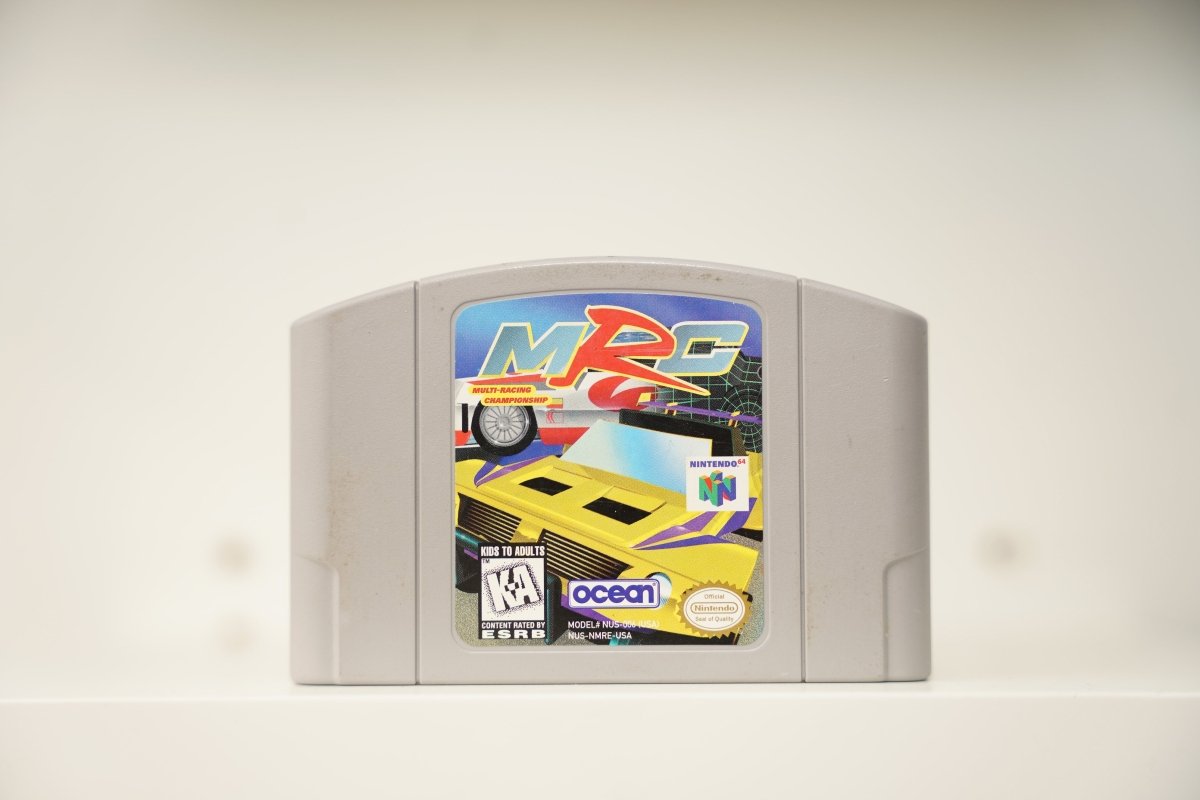 N64 MRC Multi-Racing Championship grey cartridge with yellow sports car and red rally car, stylized MRC text, Ocean logo