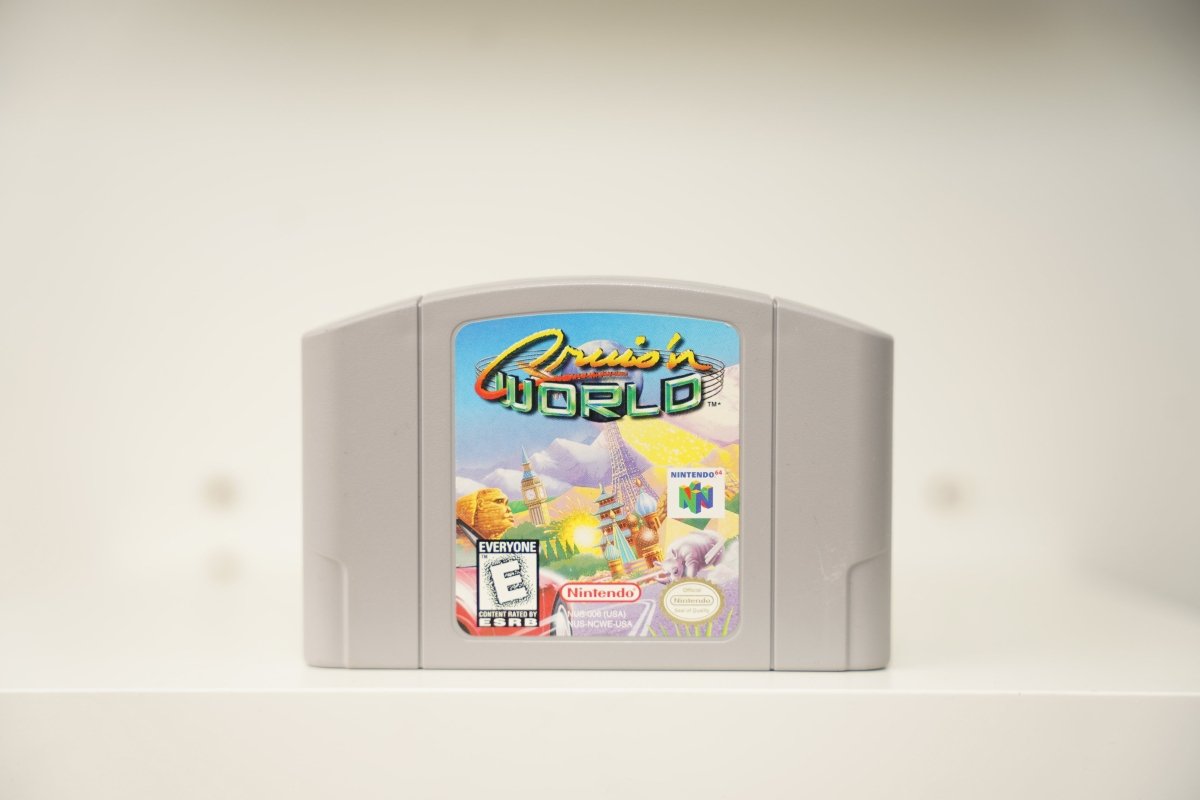 Nintendo 64 Cruis'n World gray cartridge world landmarks Eiffel Tower Big Ben Sphinx race car Cruis'n WORLD text Nintendo Everyone