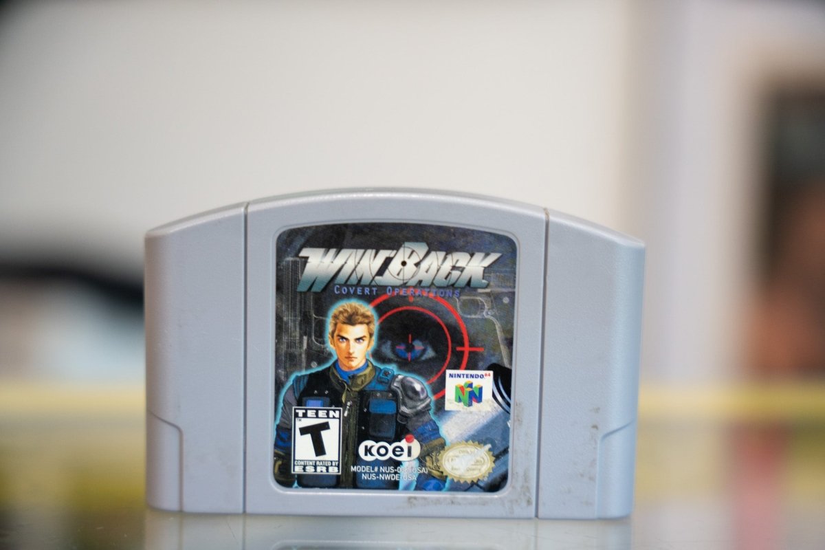 Nintendo Win Back cartridge for Nintendo 64, late 1990s, with black label and red accents on white background