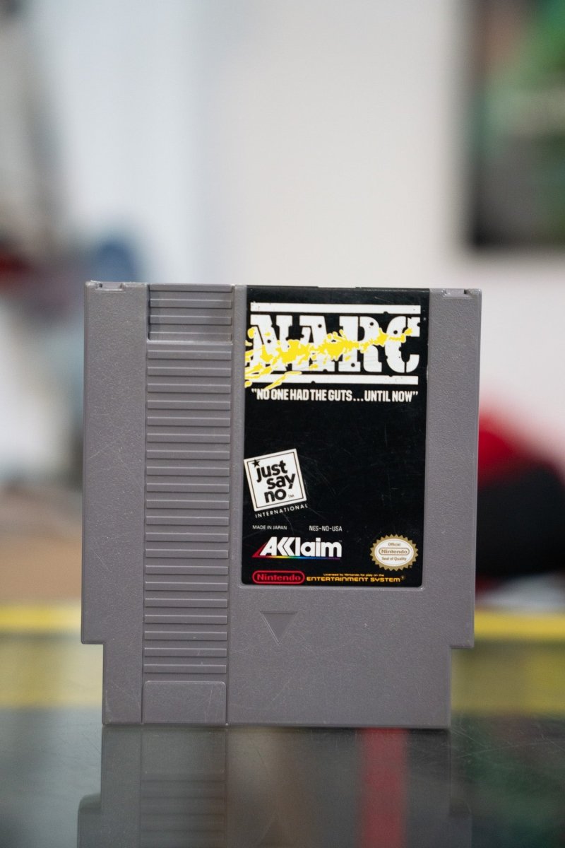 Nintendo NES NARC gray cartridge with black label white NARC lettering yellow splatter and Just Say No International logo by Acclaim