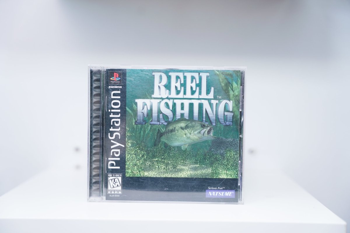 PlayStation Reel Fishing jewel case with underwater largemouth bass in green vegetation, Natsume Serious Fun logo, Kids to Adults rating