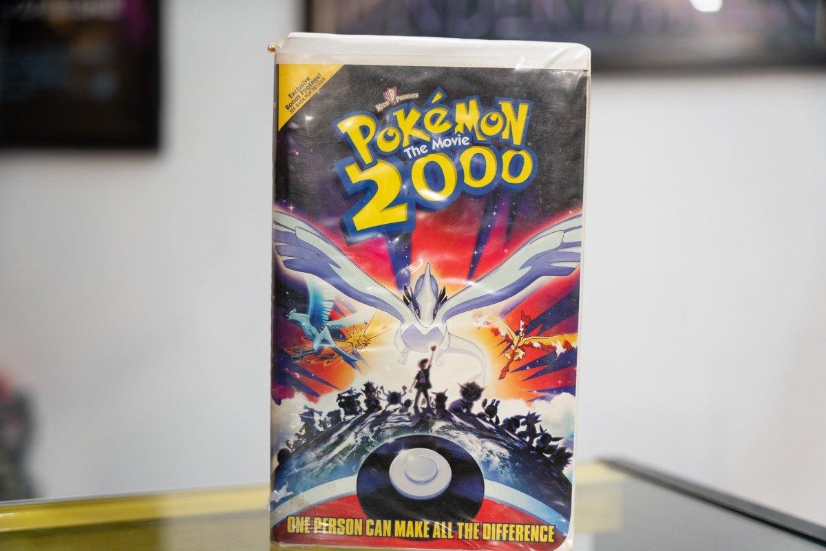 Pokemon the Movie 2000 VHS dark sleeve with Lugia wings spread Articuno Zapdos Moltres Ash silhouette Poke Ball and One Person tagline