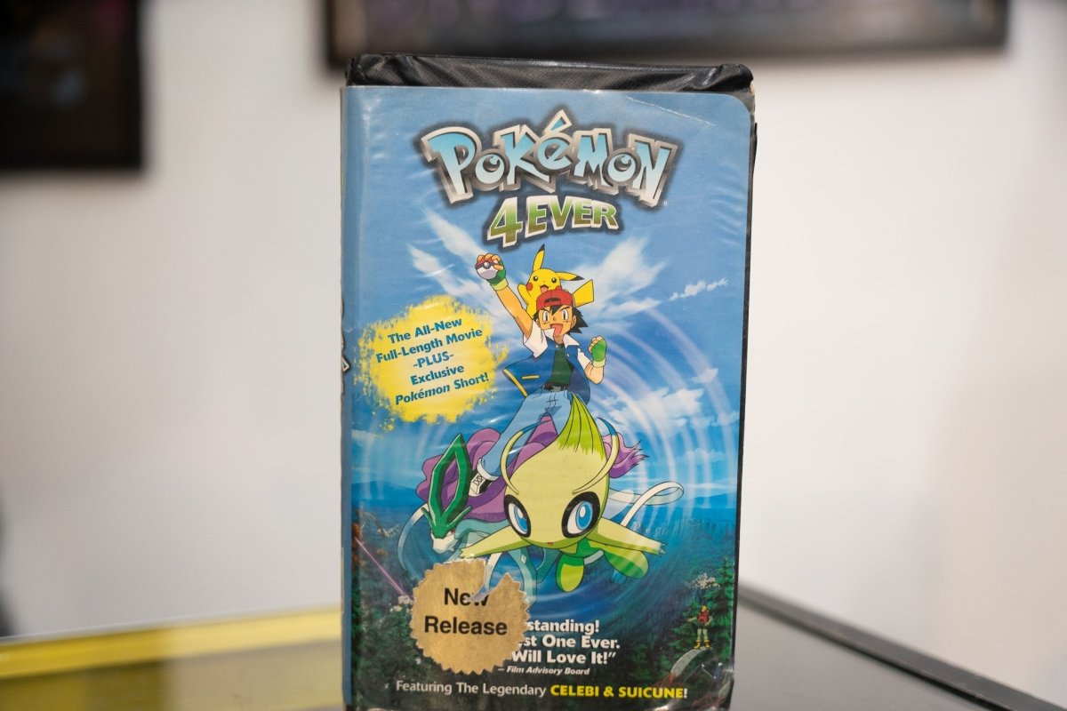 Pokemon 4Ever VHS blue sky sleeve with silver Pokemon logo gold 4Ever text Ash with Pikachu Celebi floating forest landscape