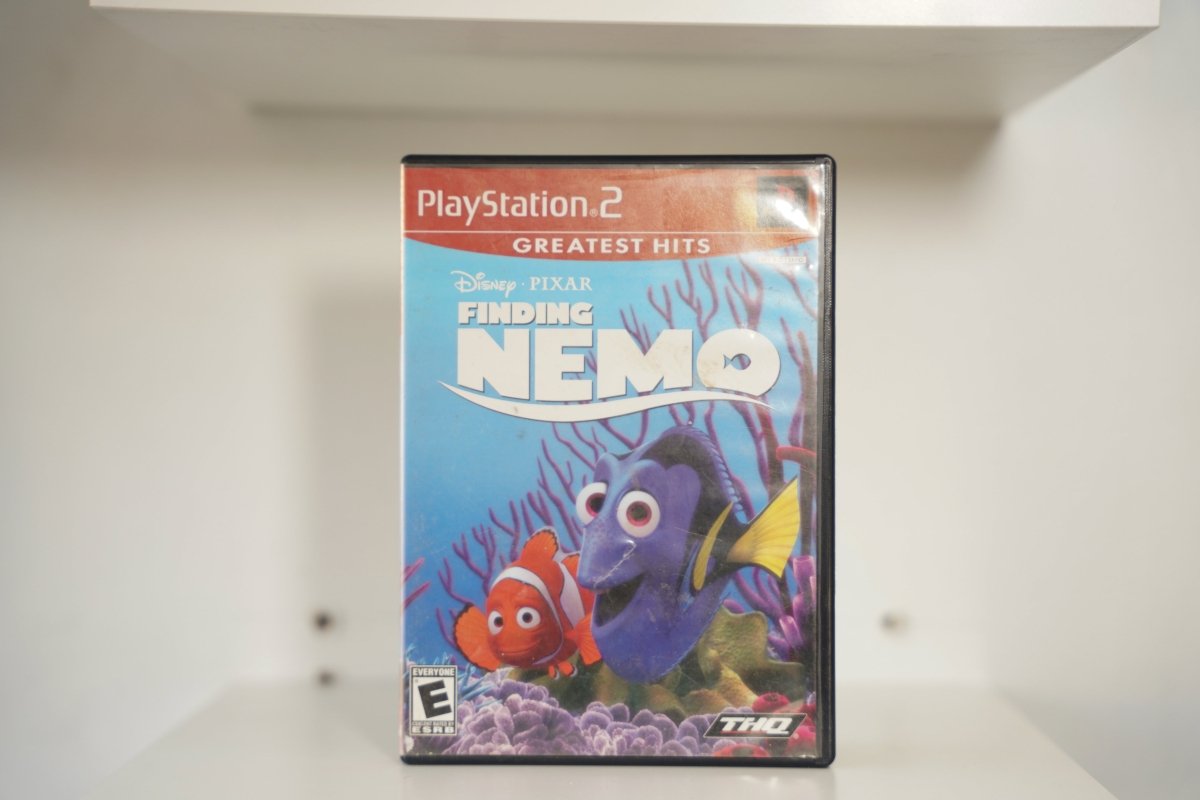 PS2 Finding Nemo Greatest Hits red label Nemo clownfish Dory blue tang coral reef FINDING NEMO white text Disney Pixar THQ Everyone