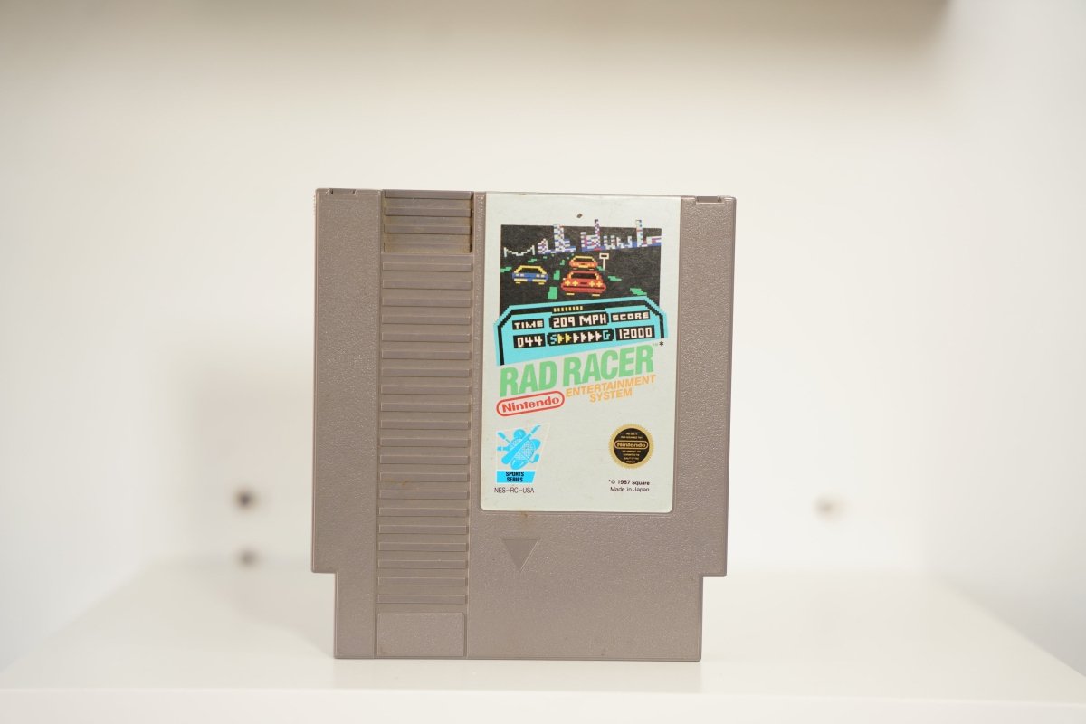 NES Rad Racer gray cartridge pixel art racing screenshot highway city RAD RACER text Nintendo Sports Series Square 1987 Made in Japan