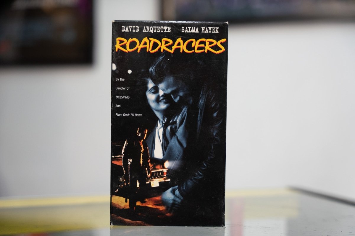 Black Roadracers VHS with blue-tinted David Arquette and Salma Hayek intimate photo yellow ROADRACERS title and Director of Desperado credit