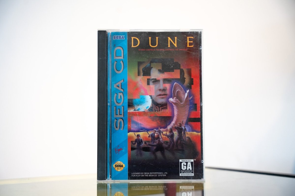 Sega CD Dune game complete in tall case blue spine Paul Atreides face sandworm desert gold DUNE text Virgin Games GA rating