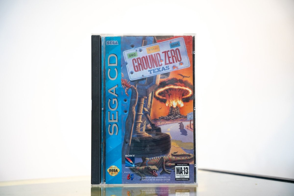 Sega CD Ground Zero Texas game complete in tall case blue spine Texas license plate nuclear explosion desert scene Sony Imagesoft Digital Pictures MA-13