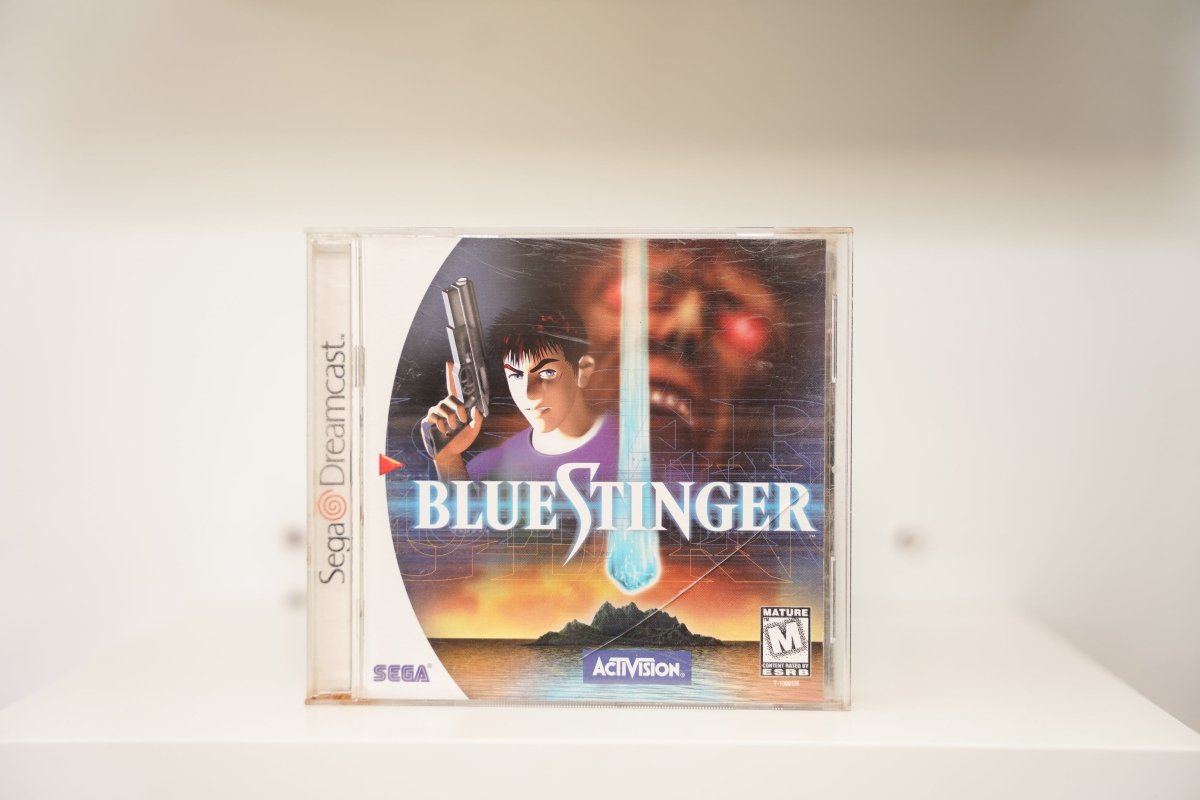 Sega Dreamcast Blue Stinger jewel case anime man gun red eye face blue beam island BLUE STINGER text Activision Sega Mature