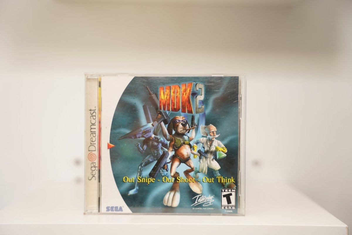 Sega Dreamcast MDK2 jewel case robot Max dog guns scientist MDK 2 red white text Out Snipe Out Shoot Out Think Interplay Sega Teen