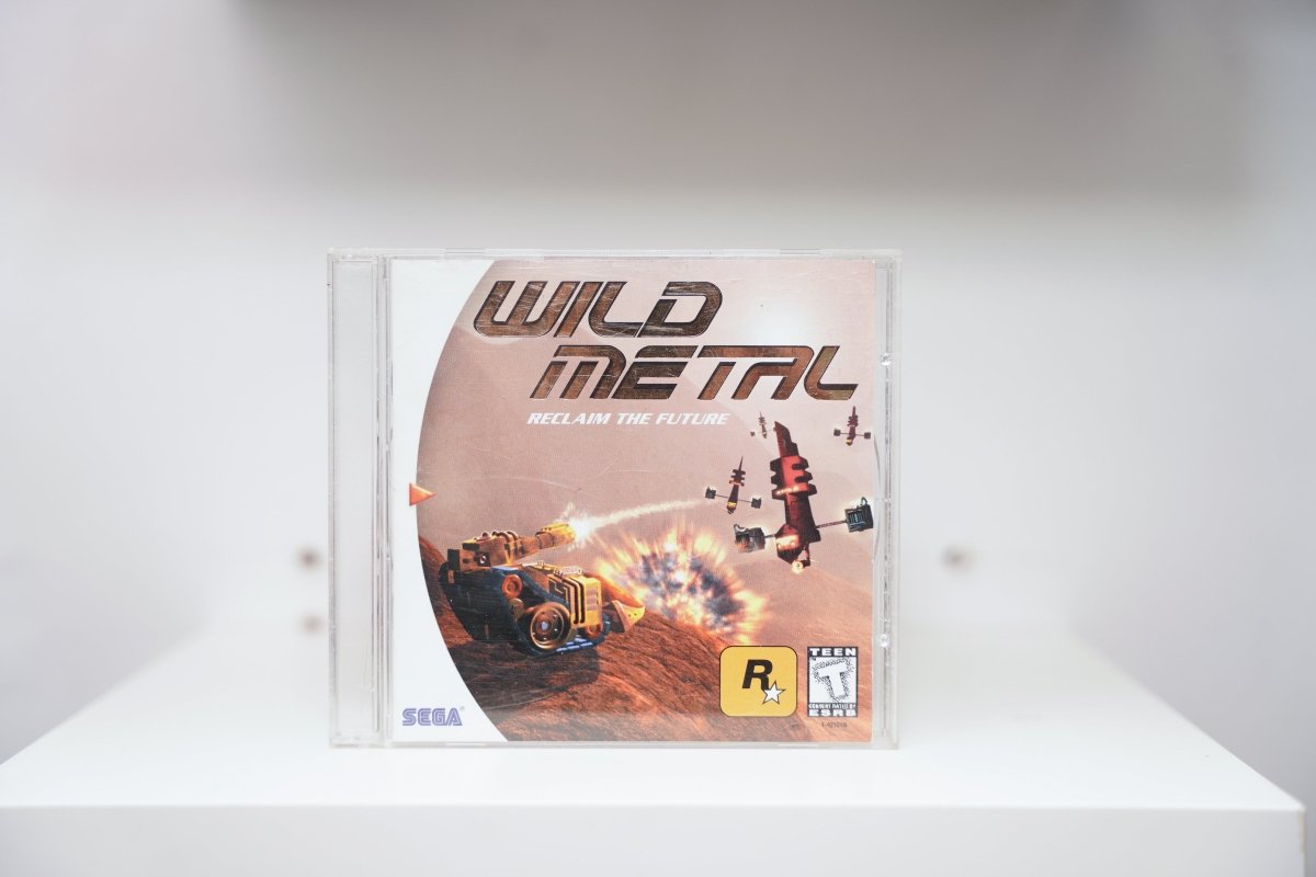 Sega Dreamcast Wild Metal jewel case tank vehicle firing explosions desert WILD METAL metallic text RECLAIM THE FUTURE Rockstar Sega Teen