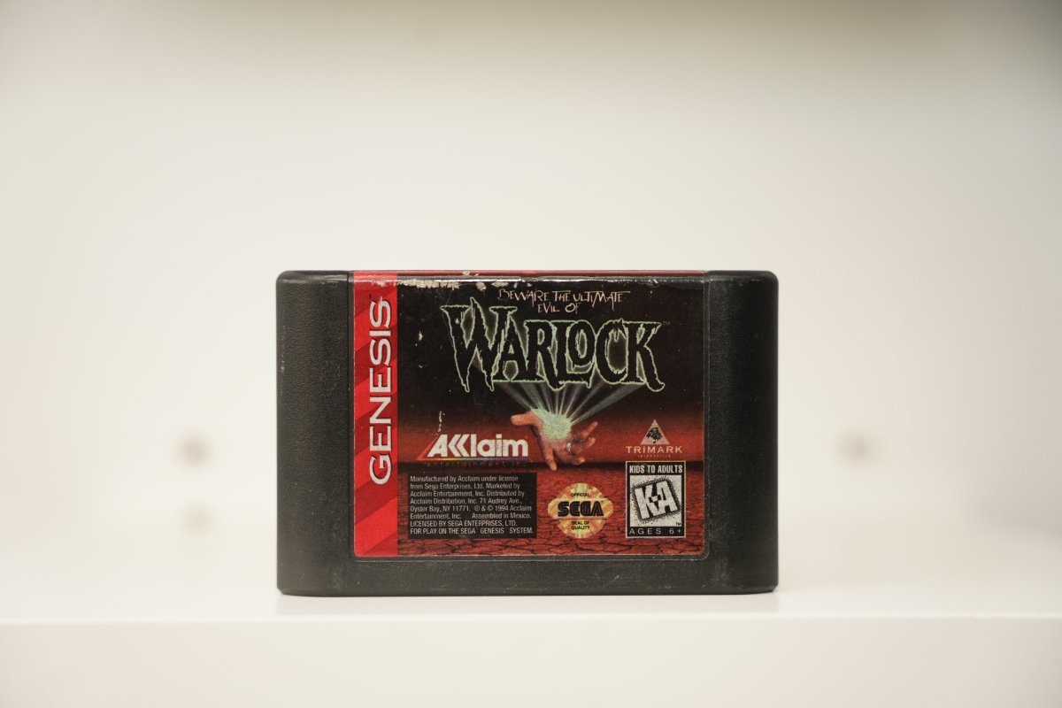 Sega Genesis Warlock cartridge with glowing magical hand on dark red background, green gothic Warlock text, Acclaim and Trimark logos