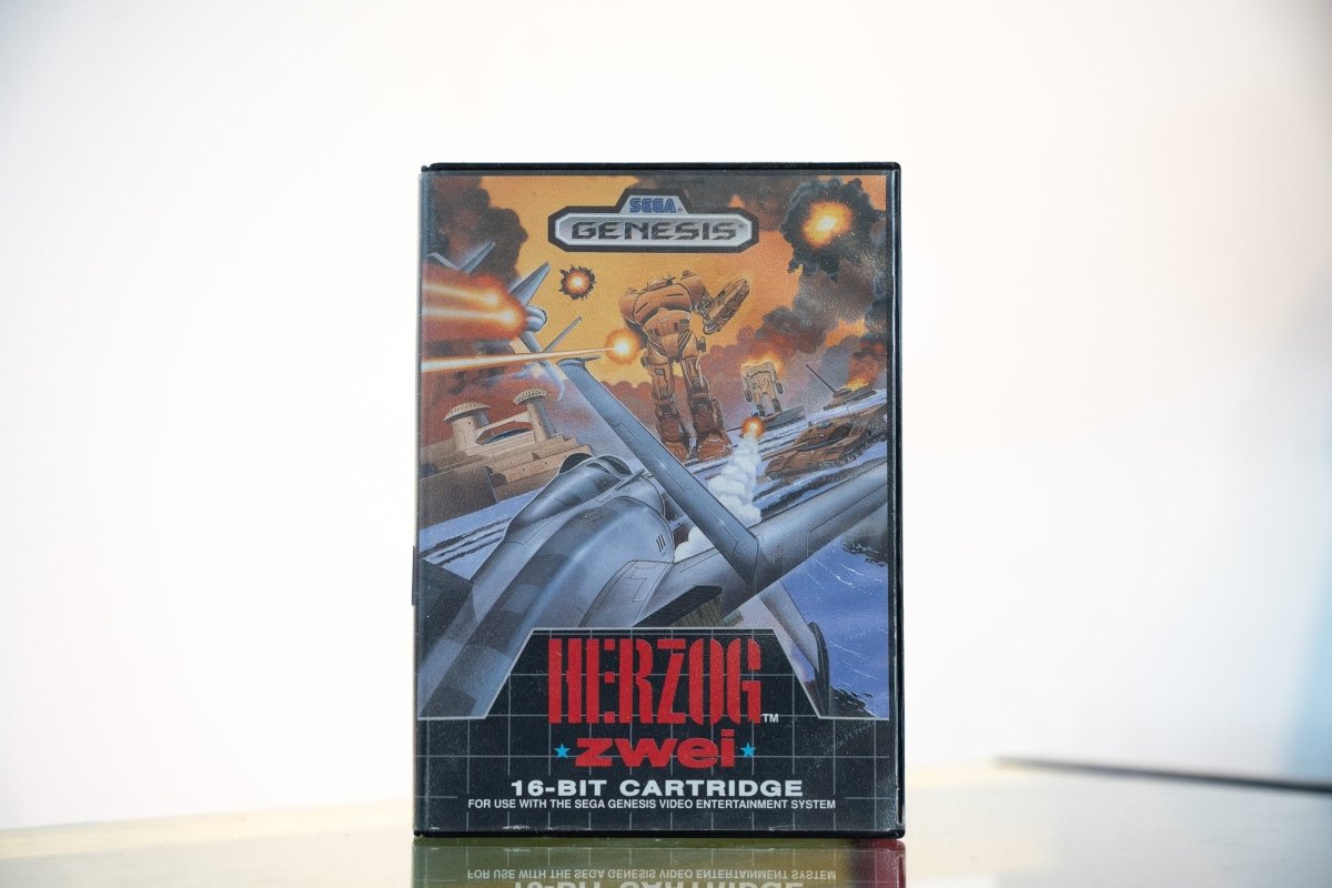 Sega Genesis Herzog Zwei game clamshell case fighter jet mech robot explosions battlefield HERZOG ZWEI metallic text Technosoft 16-Bit