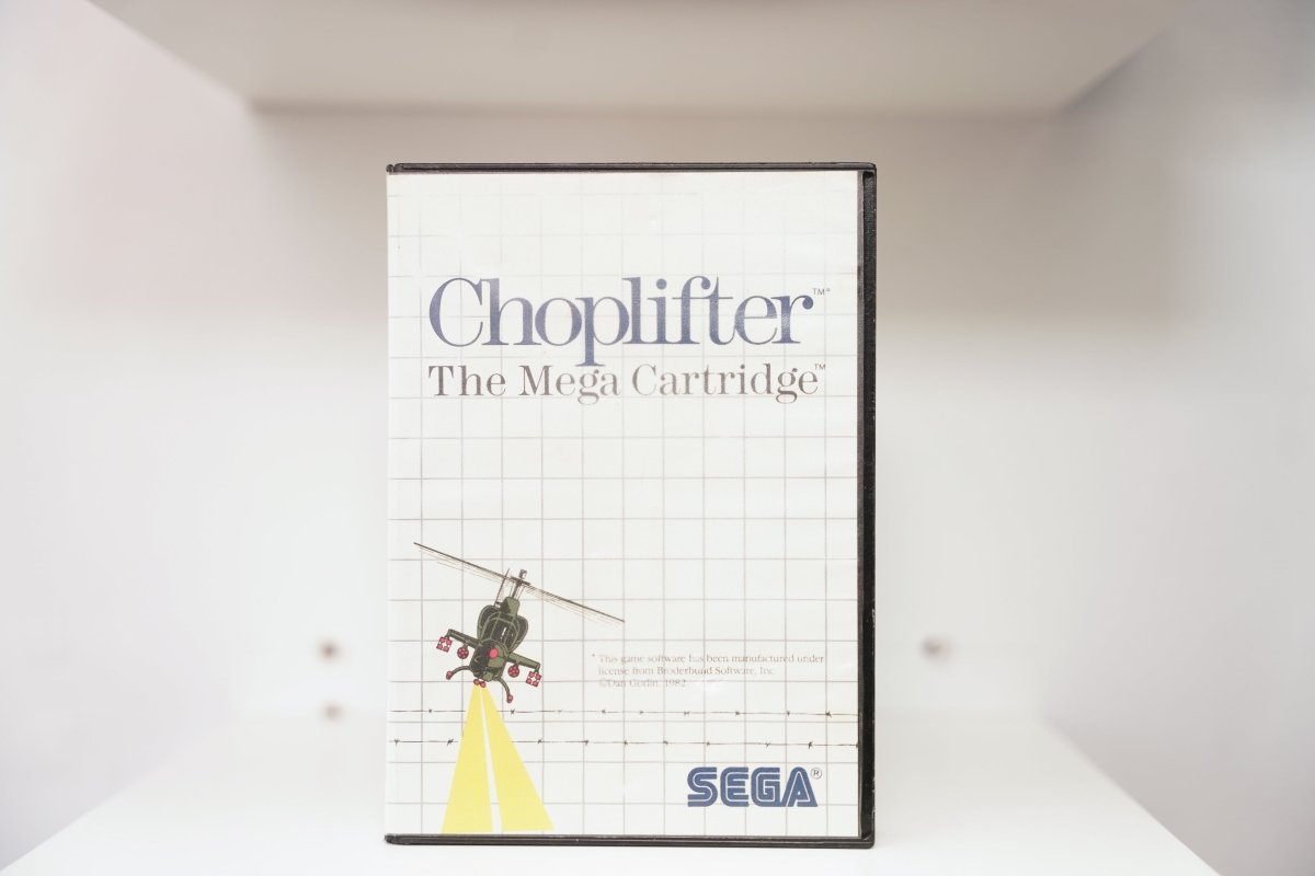 Sega Master System Choplifter clamshell case with cartoon helicopter and searchlight beam, The Mega Cartridge subtitle, Broderbund license note
