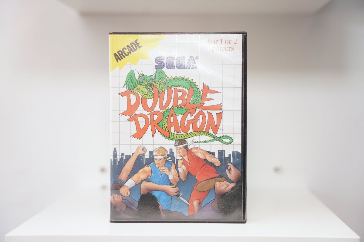 Sega Master System Double Dragon clamshell case with Billy and Jimmy Lee fighting enemies, green dragon, yellow Arcade banner, city skyline
