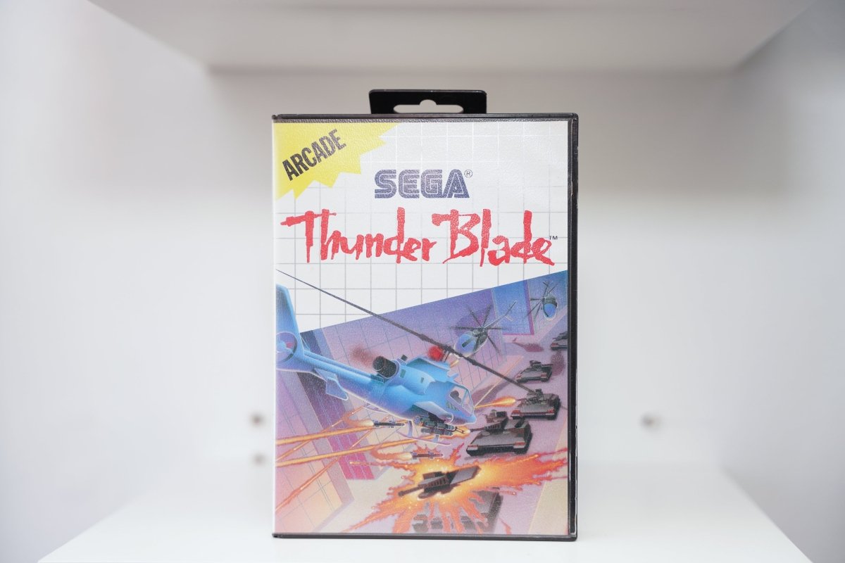 Sega Master System Thunder Blade clamshell case with attack helicopter battling tanks and explosions, yellow Arcade category banner