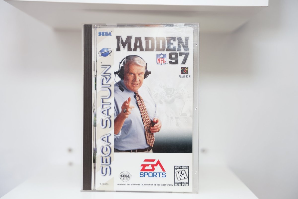Sega Saturn Madden NFL 97 jewel case with John Madden in headset pointing at camera, EA Sports logo, NFL Players Inc. logo