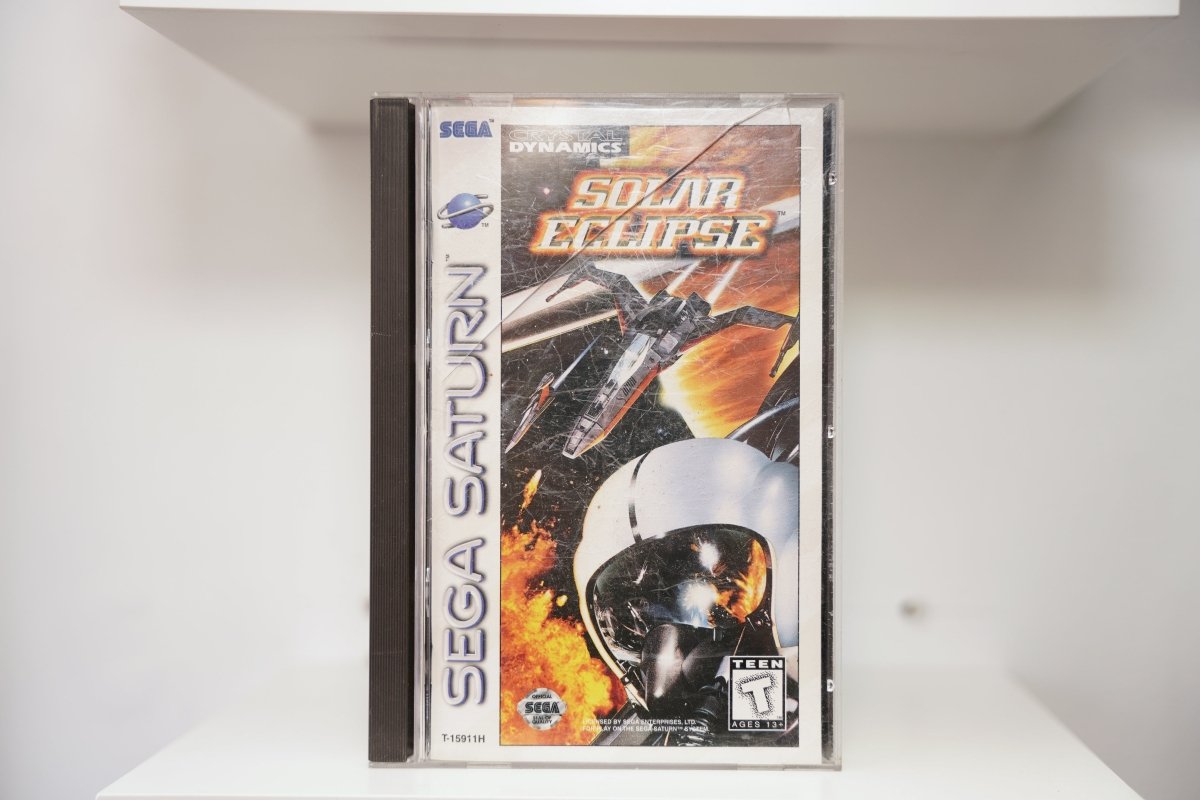 Sega Saturn Solar Eclipse jewel case with pilot helmet visor reflection and spacecraft battle, Crystal Dynamics logo, Teen rating