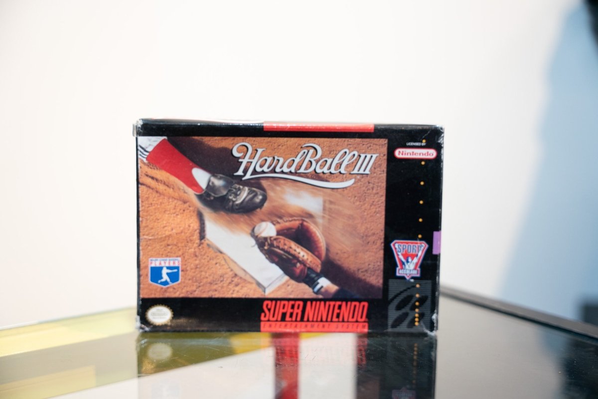 SNES HardBall III box with close-up baseball sliding play at base, cursive title, MLBPA Players logo, appears in shrink wrap