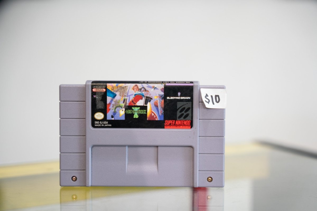 SNES Jim Power The Lost Dimension in 3D grey cartridge with colorful sci-fi action artwork, Electro Brain logo, $10 price sticker