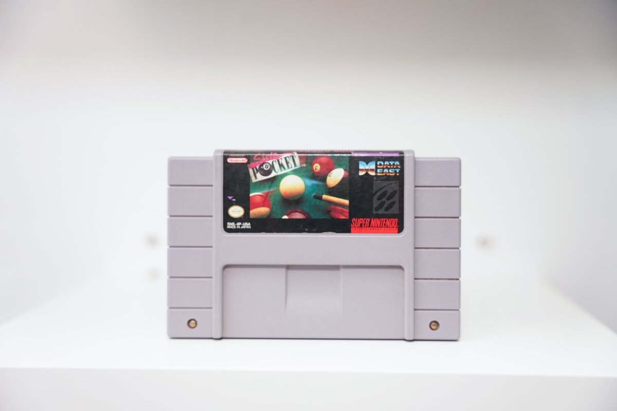 SNES Side Pocket grey cartridge with billiard balls and pool cue on table, pink neon script title, Data East logo
