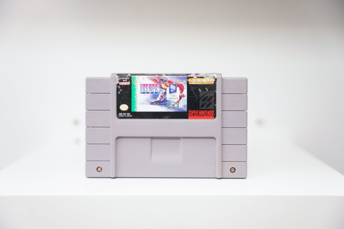 SNES Winter Olympic Games Lillehammer 94 loose gray cartridge with skiing label art and Super Nintendo branding
