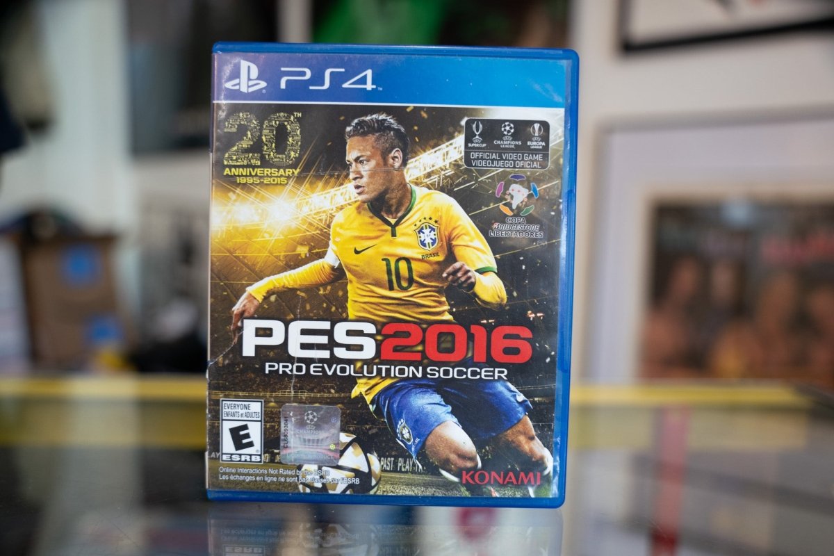 Sony PlayStation 4 PES 2016 Soccer video game case showing cover art with players in action poses, 2016