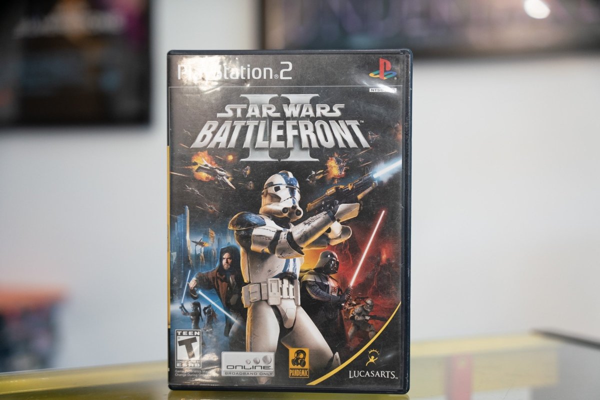 PlayStation 2 Star Wars Battlefront II case with 501st Clone Trooper blaster raised Darth Vader starfighter battles silver title LucasArts Pandemic