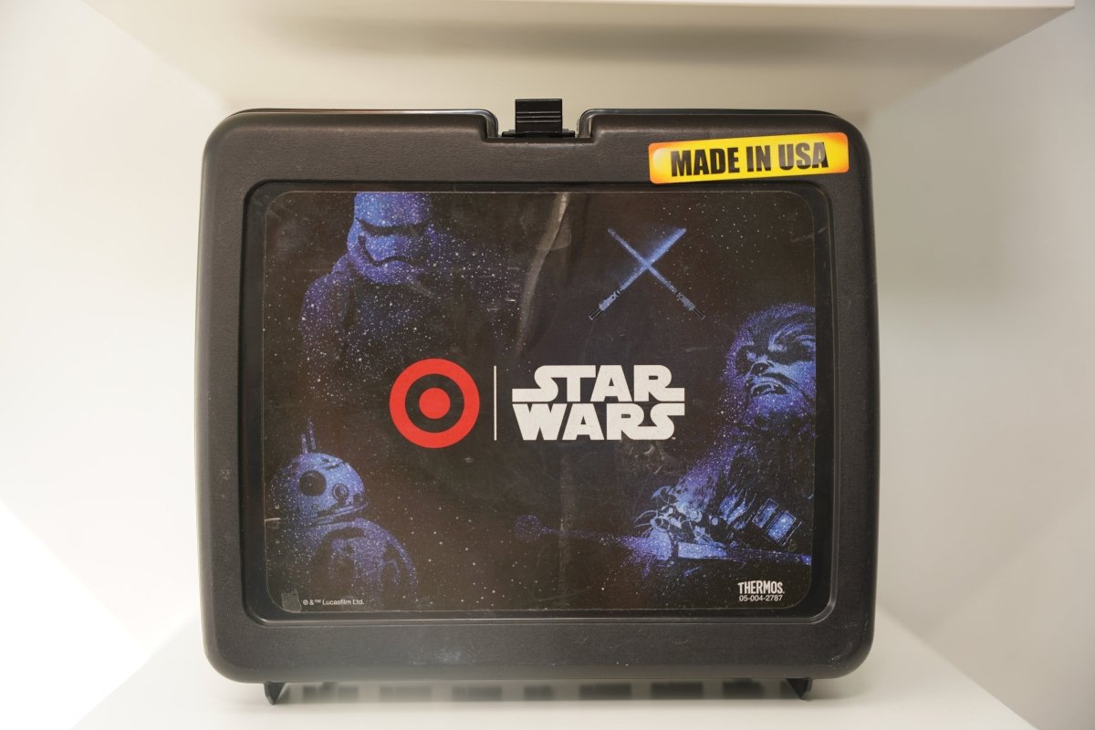 Star Wars black plastic lunch box by Thermos with Target logo, Stormtroopers, BB-8, Chewbacca artwork, and Made in USA sticker
