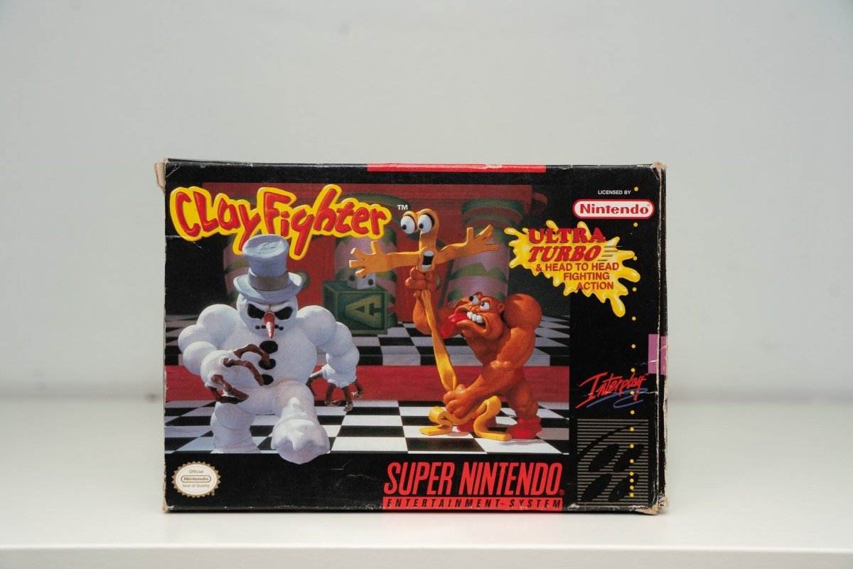 Super Nintendo ClayFighter box Bad Mr Frosty snowman Taffy clay creatures checkered floor ClayFighter yellow red text Interplay Ultra Turbo