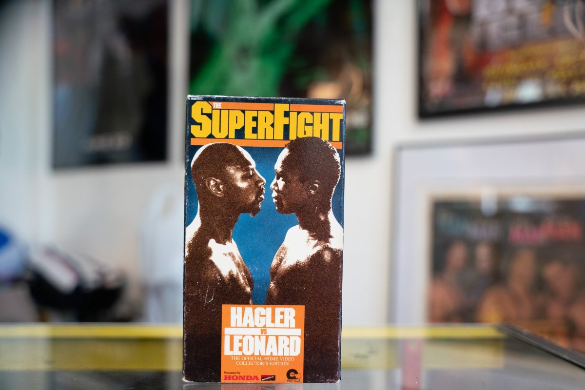 Superfight Hagler vs Leonard VHS tape, 1980s boxing match recording with printed cover artwork showing fighters in combat stance