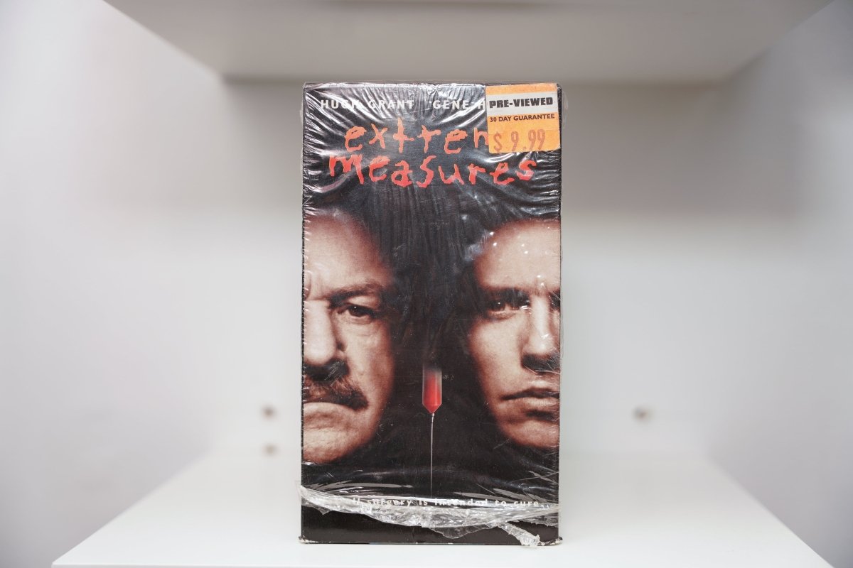 VHS Extreme Measures shrink wrap Hugh Grant Gene Hackman close-up faces red syringe extreme measures red text Pre-Viewed sticker
