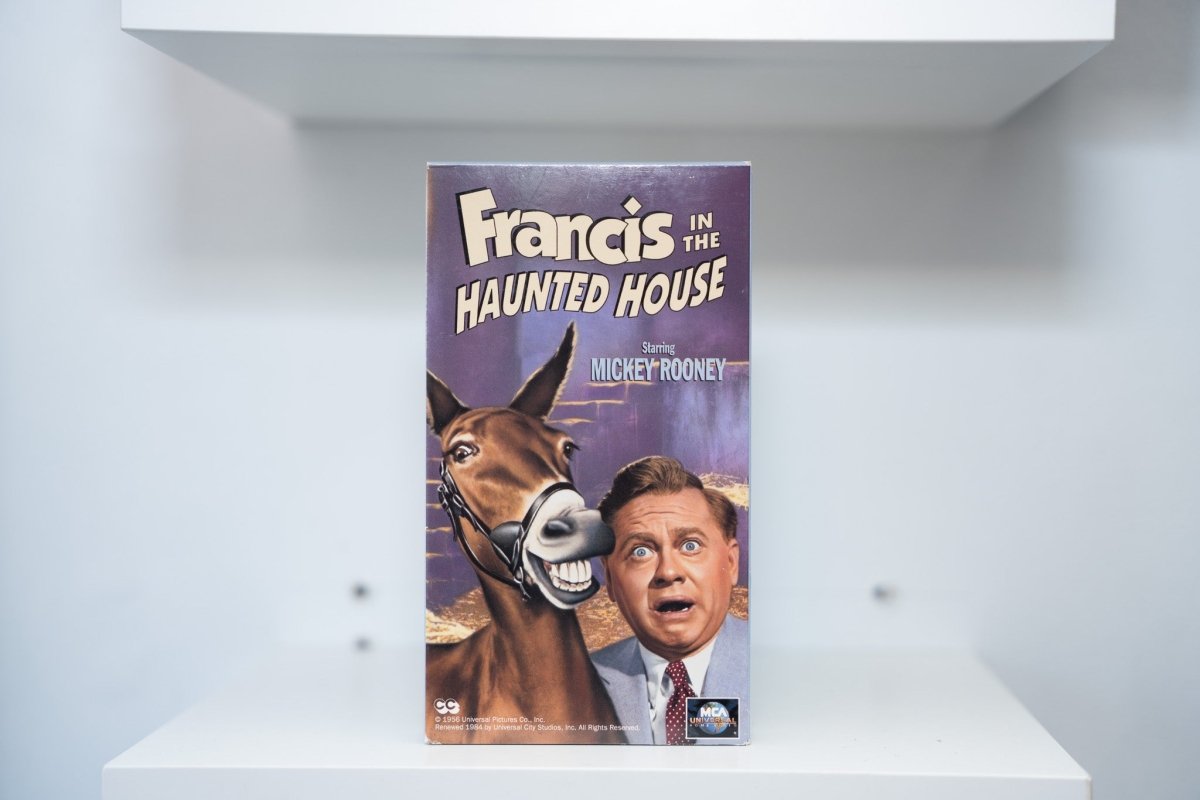 VHS Francis in the Haunted House purple cover Francis the Talking Mule grinning Mickey Rooney shocked gold white title text MCA Universal